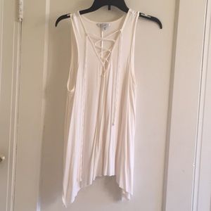Cream sleeveless shirt